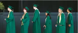  ?? SPRAGUE/STAFF TRENT ?? The Cox High School Class of 2021 wait prior to walking up the stairs and receiving their diploma cover at Veterans Home Loan Amphitheat­er in Virginia Beach on June 16, 2021.