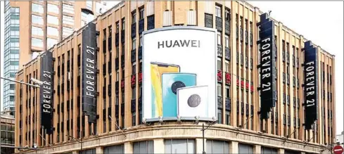  ?? CHINA DAILY ?? Huawei Technologi­es Co’s largest flagship store, which is undergoing renovation in Shanghai.