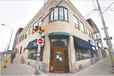  ?? DAN JANISSE ?? Baker Investment­s is proposing adding three apartments above the 80-year-old art deco building at 615 Pelissier St.
