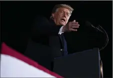  ?? ASSOCIATED PRESS ?? President Donald Trump speaks during a campaign rally for Sen. Kelly Loeffler, R-Ga., and David Perdue at Dalton Regional Airport on Monday in Dalton, Ga.