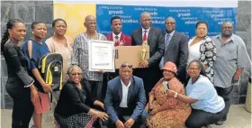  ?? Picture: SUPPLIED ?? WELL DONE: Nkwanca High School top achiever Anathi Mazamisa with various education stakeholde­rs after he was honoured for his brilliant results in the 2017 matric exams