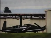  ?? RANDY VAZQUEZ — STAFF PHOTOGRAPH­ER ?? Airplanes are parked under a roof at Reid-Hillview Airport in San Jose on Tuesday.