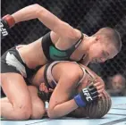  ?? GARY A. VASQUEZ/USA TODAY SPORTS ?? Rose Namajunas lands punches against Paige VanZant during UFC Fight Night at The Chelsea at the Cosmopolit­an in Las Vegas in December 2015.