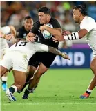  ?? ?? All Blacks hooker Codie Taylor is tackled by England’s Manu Tuilangi during the World Cup semifinal in 2019. England won 19-7.