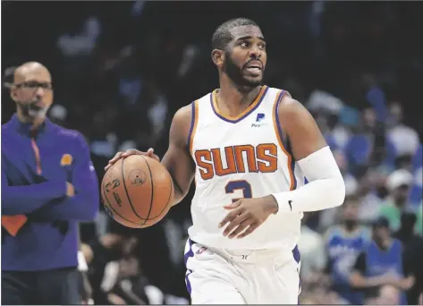  ?? TONY GUTIERREZ/AP ?? PHOENIX SUNS GUARD CHRIS PAUL (3) moves the ball up court against the Dallas Mavericks during the first half of Game 6 of a second-round playoff series on Thursday in Dallas.