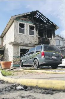  ?? COLLEEN DE NEVE/ CALGARY HERALD ?? This home in the 100 block of Covehaven Gardens N. E. suffered extensive damage in an overnight fire.