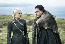  ?? Helen Sloan/HBO ?? Emilia Clarke as Daenerys Targaryen and Kit Harington as Jon Snow get close in HBO’s “Game of Thrones.”