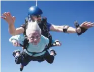  ?? DANIEL WILSEY VIA AP ?? Dorothy Hoffner, 104, falls through the air Sunday with tandem jumper Derek Baxter at Skydive Chicago in Ottawa, Ill.