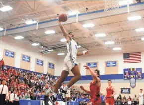  ?? CURT HOGG / NOW NEWS GROUP ?? Brookfield Central forward David Joplin soars for a dunk against Sussex Hamilton.