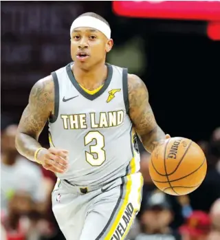  ?? THE ASSOCIATED PRESS ?? Point guard Isaiah Thomas, shown during the Cleveland Cavaliers’ home game against the Houston Rockets last Saturday, was part of a busy day of trading in the NBA on Thursday. The Cavs sent Thomas to Los Angeles as part of a deal with the Lakers, but...