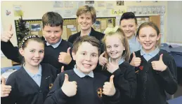 ??  ?? St Cuthbert’s RC Primary headteache­r, Jane Ward, with Year 6 pupils.