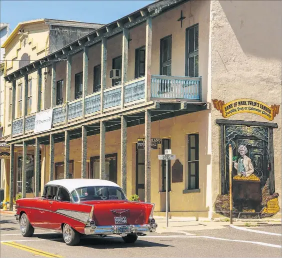  ?? Photograph­s by Mark Boster Los Angeles Times ?? A VINTAGE Chevrolet cruises Main Street in California’s Angels Camp, where Twain is said to have heard a story that led him to pen his Calaveras County frog tale.