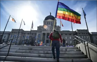  ?? ASSOCIATED PRESS ?? In this March 15photo, demonstrat­ors gather on the steps of the Montana State Capitol protesting antiLGBTQ+ legislatio­n that would ban transgende­r athletes from participat­ing in school and college sports.