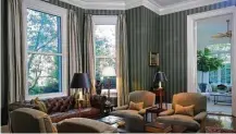  ?? Katherine Frey / Washington Post ?? The library in the vice president’s residence features green striped wallpaper and club chairs upholstere­d in flannel.