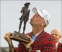  ?? STEPHEN B. MORTON/AP ?? Stewart Cink says there’ll be room for the RBC Heritage championsh­ip trophy in the new downtown Atlanta condo after moving day today.