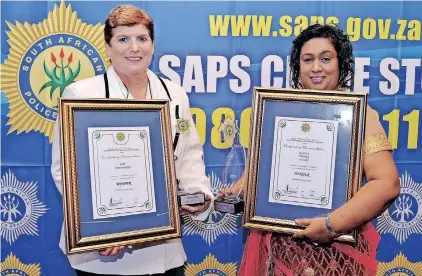  ?? ?? BRIGADIER Ruth de Villiers received a certificat­e on behalf of Chatsworth Police station and Captain Cheryl Pillay received a Woman of the Year award during the KZN Police Excellence awards at the Coastlands Hotel. See page 4. | TUMI PAKKIES/ African News Agency (ANA)