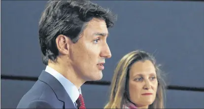  ?? CP FILE ?? Prime Minister Justin Trudeau and Foreign Affairs Minister Chrystia Freeland speak at a news conference in Ottawa on May 31, 2018. A look at the consequenc­es of escalating trade disputes involving America warns that a deteriorat­ion into an all-out,...