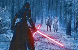  ??  ?? None shall pass: Kylo Ren (Adam Driver) wields a scary crossguard lightsaber.