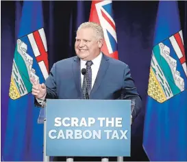  ?? JEFF MCINTOSH/THE CANADIAN PRESS ?? Ontario Premier Doug Ford speaks to supporters at an anti-carbon tax rally in Calgary on Oct. 5.
