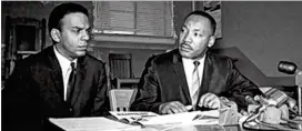  ?? FILE ?? Andrew Young and Martin Luther King Jr. appear at a press conference at the Prince Hall Masonic Lodge on Nov. 2, 1964. The lodge housed the first office of the Southern Christian Leadership Conference.
