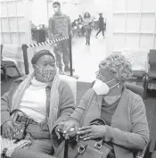  ?? MIKE STOCKER/SOUTH FLORIDA SUN SENTINEL ?? Ketley Joachim sits with her mom, Suzanne Noel, after she received her vaccine during an interfaith COVID-19 vaccinatio­n drive at the Aventura Turnberry Jewish Center in Aventura on Feb. 4.