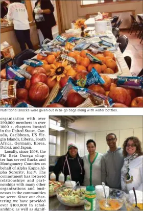  ??  ?? Nutritiona­l snacks were given out in to-go bags along with water bottles. Helping to serve the food were, from left: Frankie AlstinBroo­ks, Stephanie Harris,Aaron Brooks and Carol CollazoBro­oks.