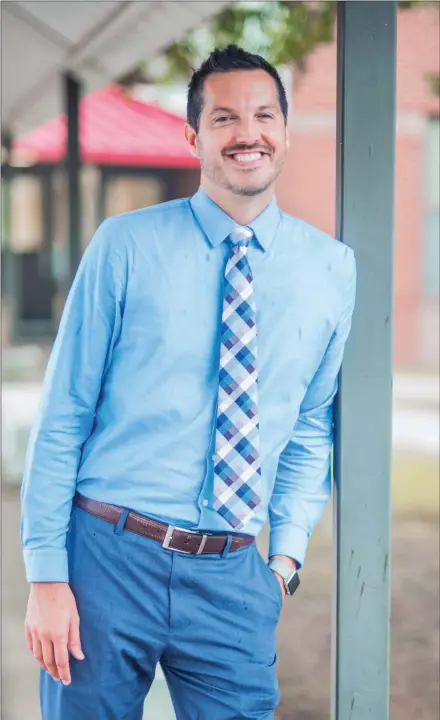  ?? WILLIAM HARVEY/THREE RIVERS EDITION ?? Andy Sullivan stands outside of Ward Central Elementary School in Cabot. Sullivan was named principal of the school in June after serving as its assistant principal since 2013.