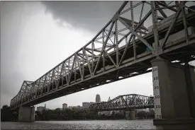  ?? ?? The Brent Spence Bridge straddles the border between Ohio and Kentucky in Cincinnati. President Joe Biden said the federal infrastruc­ture bill has money to replace “one of the most notorious bridges in the country.”