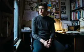  ?? Canadian Press photo ?? Galen Watts, 30, poses for a photograph at his apartment in Toronto on Monday. Anxiety and apathy have both come easily to Watts so far this year. The PhD student at Queen’s University has watched with a mix of dismay and detachment as headlines about rampant wildfires in Australia and the threat of imminent war between the United States and Iran flooded his screens.