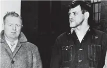  ?? Associated Press file photo ?? Joseph L. Taborsky, right, with a detective, is taken back to State Police headquarte­rs, Feb. 28, 1957, for further questionin­g in six murders connected with a series of Connecticu­t holdups.