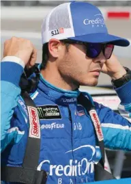  ?? (Photo by Steve Helber, AP) ?? Kyle Larson prepares to get in his car prior to qualifying for the race at Richmond Internatio­nal Raceway Friday.