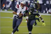  ?? ELAINE THOMPSON — THE ASSOCIATED PRESS, FILE ?? Seahawks strong safety Jamal Adams (33) closes in on a sack of Patriots quarterbac­k Cam Newton (1) during the second half on Sunday in Seattle.