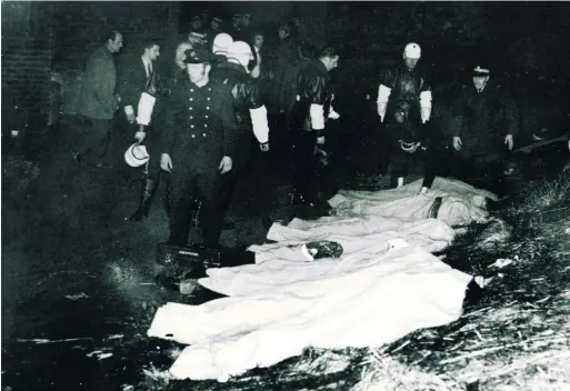  ??  ?? Tragedy: bodies of the vctims covered up following the Ibrox Park disaster