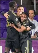  ?? Willie J. Allen Jr. / Associated Press ?? Los Angeles FC players celebrate a goal against Orlando City during an MLS match on Saturday. Los Angeles won 4-2.