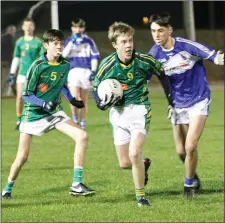  ??  ?? Oisín Meyler on the ball for Our Lady’s Island/St. Fintan’s.