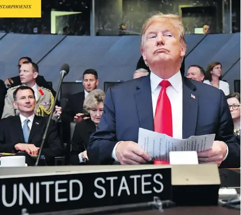  ?? GEERT VANDEN WIJNGAERT / THE ASSOCIATED PRESS ?? U.S. President Donald Trump attends a meeting of the North Atlantic Council during a summit of NATO leaders at the group’s headquarte­rs in Brussels on Wednesday. The day ended with Trump demanding that members such as Canada double their defence...