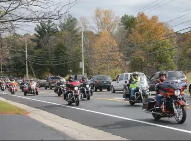  ??  ?? Hundreds of motorcycli­sts participat­e in the 20th annual Toys for Tots Benefit Ride on Sunday, beginning at Brunswick Harley-Davidson.