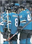  ?? NHAT V. MEYER — STAFF PHOTOGRAPH­ER ?? Sharks teammates surround Logan Couture after he scored in the first period Tuesday against the Dallas Stars.