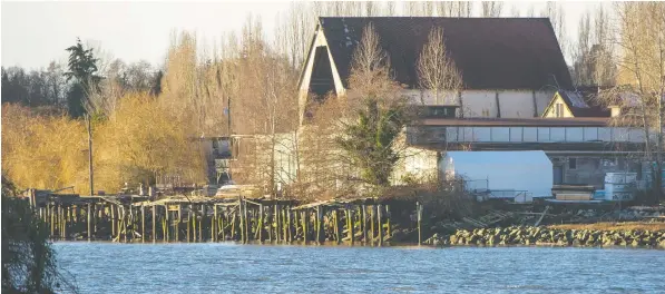  ?? —ARLEN REDEKOP ?? The developer that owns the Celtic Shipyard site in South Vancouver wants to subdivide it for residentia­l use, giving about half to the city, including Fraser River frontage, green space and a new road through the middle.