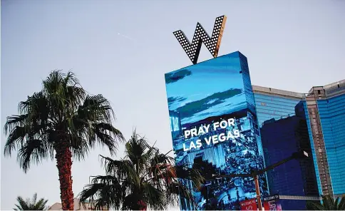  ?? — AFP photo ?? The W Las Vegas displays a message for the victims of Sunday night’s mass shooting in Las Vegas.