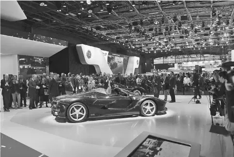  ??  ?? The LaFerrari Aperta automobile, produced by Ferrari, sits on display on the first press day of the 2016 Paris Motor Show at Porte de Versailles exhibition centre in Paris, France, in September.