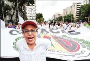  ?? JUAN BARRETO/AFP ?? People march against the government of Venezuelan President Nicolás Maduro in the streets of Caracas on October 26, 2016.