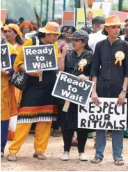  ??  ?? Women hold placards as they attend a protest march called by various Hindu organisati­ons against the lifting of ban by Supreme Court that allowed entry of young women to the Sabarimala temple, in Kochi yesterday.