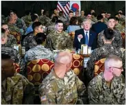  ?? DOUG MILLS / THE NEW YORK TIMES ?? President Donald Trump has lunch with U.S. and South
Korean troops during avisit to Camp Humphreysi­n South
Korea on Tuesday. South Korean President Moon Jae-in is seated at right.