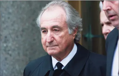  ?? File / Mario Tama / Getty Images ?? Bernie Madoff, the financier who ran the largest Ponzi scheme in history, has died of natural causes in federal prison this month. He is shown exiting federal court March 10, 2009, in New York City.