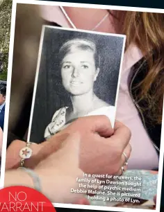  ??  ?? In a quest for answers, the family of Lyn Dawson sought the help of psychic medium Debbie Malone. She is pictured holding a photo of Lyn.