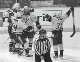  ?? BRUCE BENNETT, GETTY IMAGES ?? Filip Forsberg of the Predators celebrates with teammates after scoring a goal in the third period against the Anaheim Ducks at Bridgeston­e Arena in Nashville on Tuesday night.