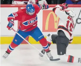  ?? GRAHAM HUGHES /THE CANADIAN PRESS ?? Montreal’s Andrei Markov collides with New Jersey’s Stefan Matteau, long before the Hab defenceman became the hometown hero by scoring the winning goal in overtime.