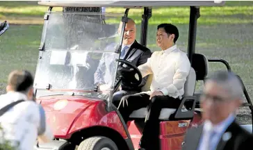  ?? —MARIANNE BERMUDEZ ?? PALACE DRIVER President Marcos drives a golf cart with visiting New Zealand Prime Minister Christophe­r Luxon as his passenger at the Malacañang grounds on Thursday. Luxon is on an official visit to Manila, the final leg of his Southeast Asian tour.