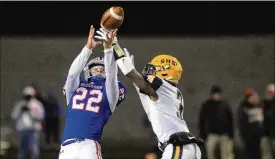  ?? DAVID JABLONSKI / STAFF* ?? Springfiel­d’s Christian Mcmillian breaks up a pass against Marysville in Friday’s regional final victory at Hilliard Darby High School.